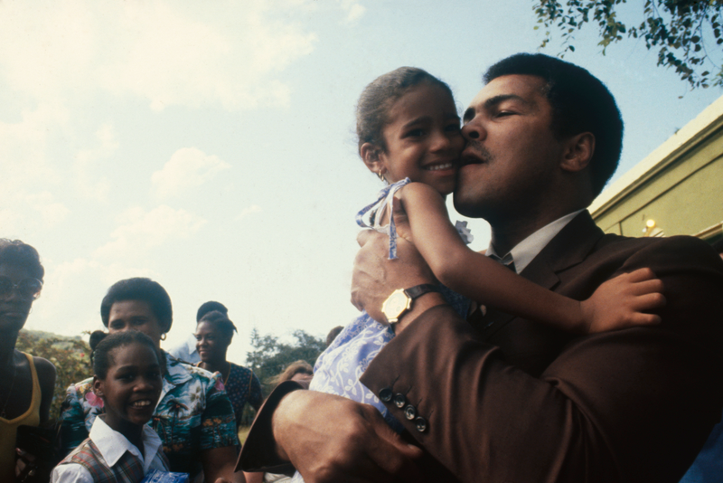 Muhammad Ali amidst Cruzan youth on his recent trip to the U.S. Virgin Islands. "The Champ" spent 3 days on both St. Croix and St. Thomas meeting island youngsters and donating his talents to aid five local charities: Boy Scouts, Girl Scouts, Special Olympics, Queen Louise Home for Children and Camp Arawak.Getty Images